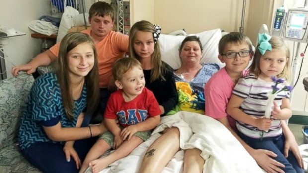 Beth Laitkep surrounded by children, Stephanie Culley
