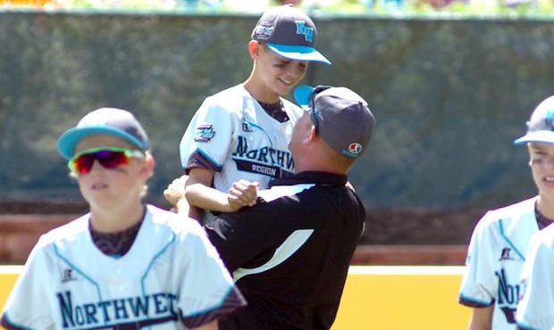 Father and son celebrating after the game. Source: Bend Bulletin